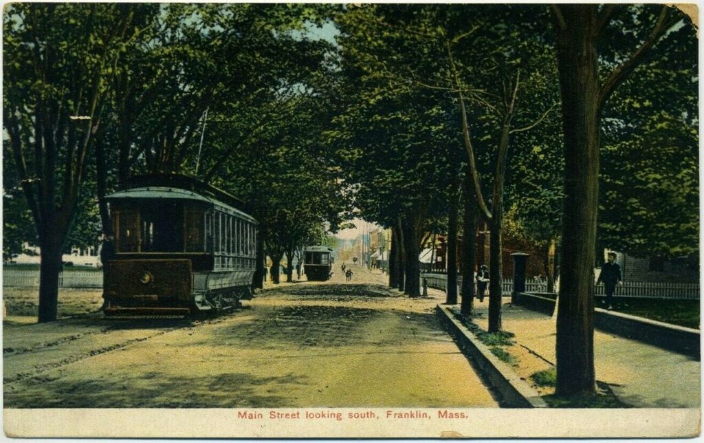 Vintage postcard of tree-lined Main Street in Franklin, Massachusetts